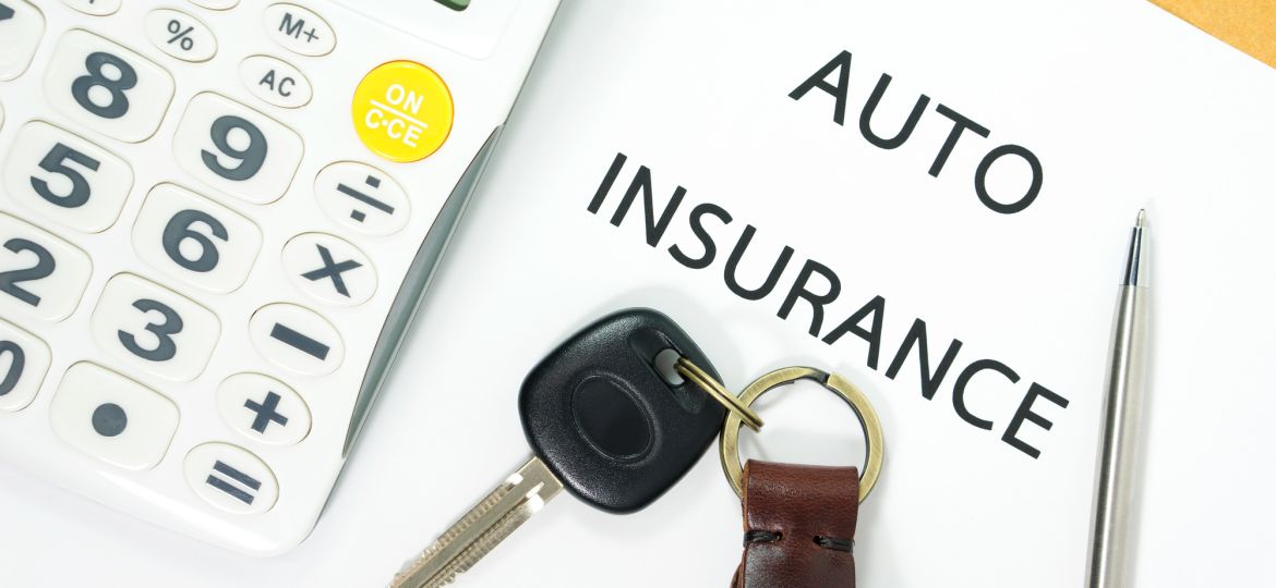 Auto insurance with car key and calculator